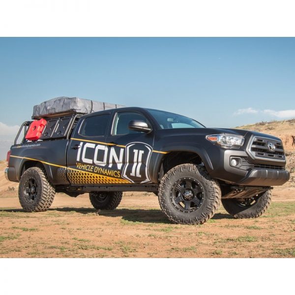 0-2.75 inch Lift Kit by ICON on a black 2016 Toyota Tacoma - side view